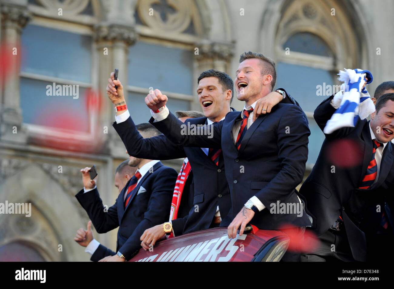 Cardiff, UK. 5th May 2013. Cardiff City FC players show off their Championship trophy to thousands of fans gathered to show their support. The team were paraded through the city in an open top bus after winning the Championship and being promoted to the Premier League. Credit: Polly Thomas/Alamy Live News Stock Photo