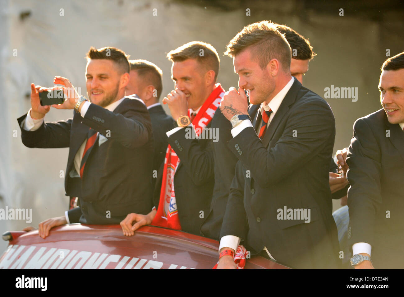 Cardiff, UK. 5th May 2013. Cardiff City FC players show off their Championship trophy to thousands of fans gathered to show their support. The team were paraded through the city in an open top bus after winning the Championship and being promoted to the Premier League. Credit: Polly Thomas/Alamy Live News Stock Photo
