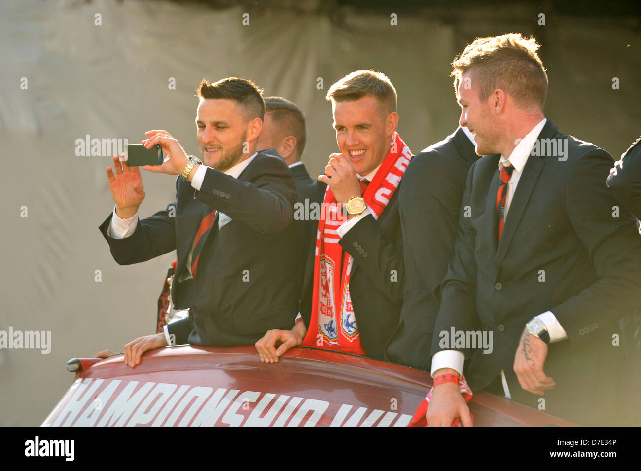 Cardiff, UK. 5th May 2013. Cardiff City FC players show off their Championship trophy to thousands of fans gathered to show their support. The team were paraded through the city in an open top bus after winning the Championship and being promoted to the Premier League. Credit: Polly Thomas/Alamy Live News Stock Photo