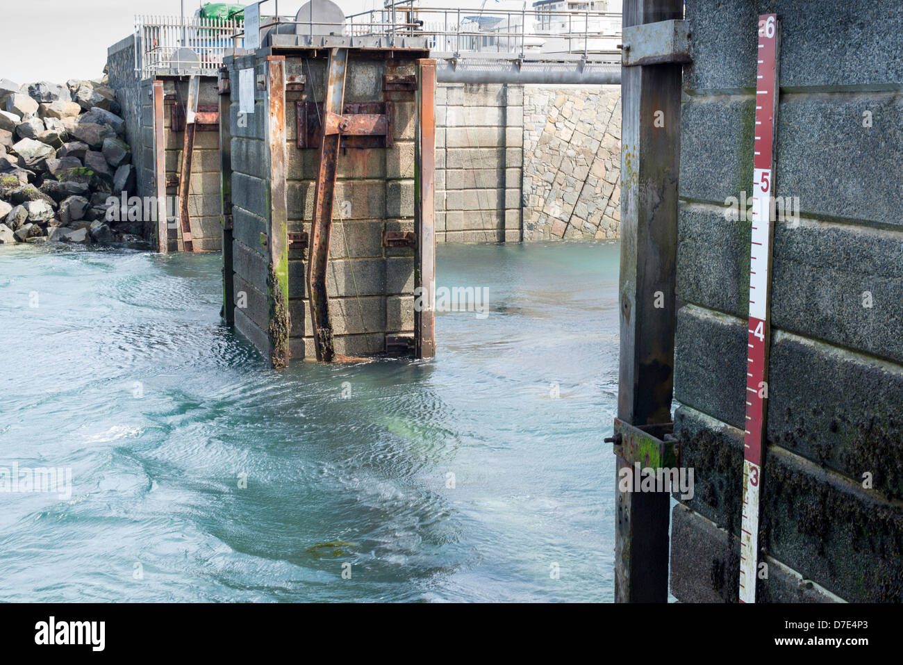 Marina entrance and automatic tidal cill gate. Stock Photo