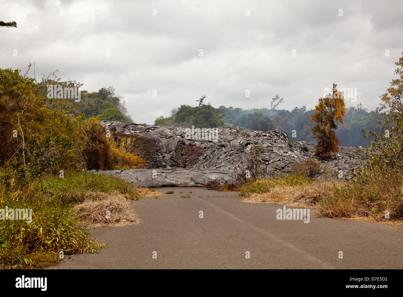 Lava flowing over a road on The Big Island of Hawaii Stock Photo - Alamy