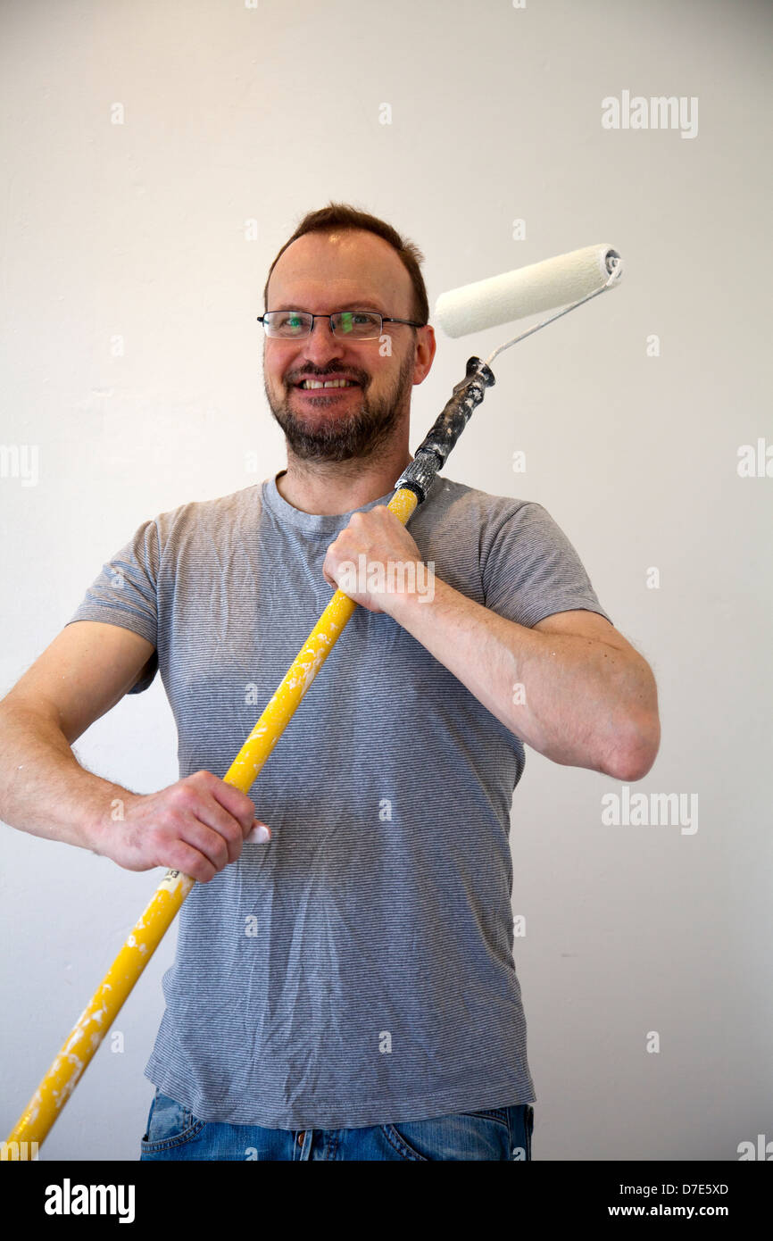 Man Posing With Paint Roller on Extension Stock Photo Alamy