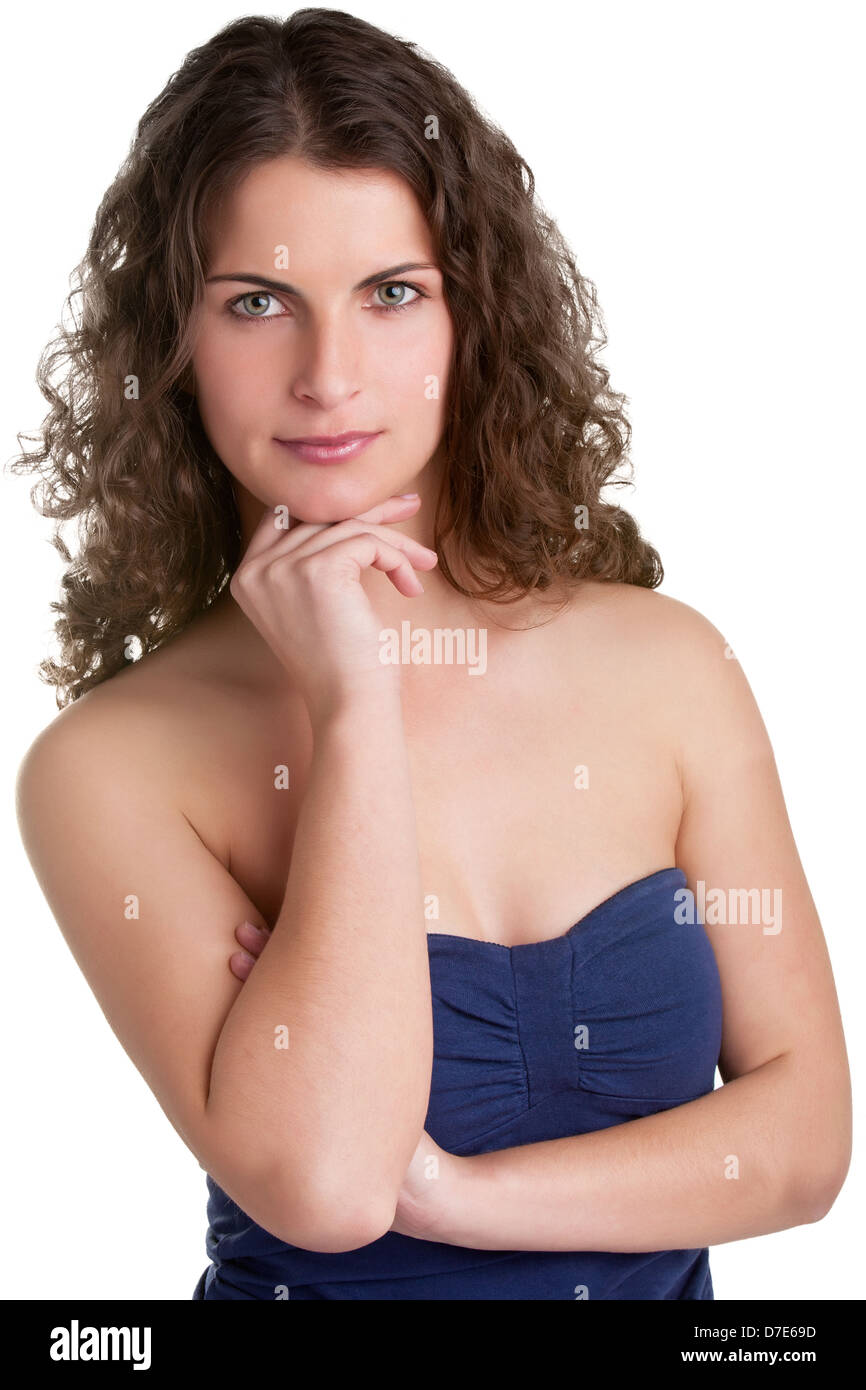Young woman looking at the camera, hand under chin, thinking, isolated in white Stock Photo