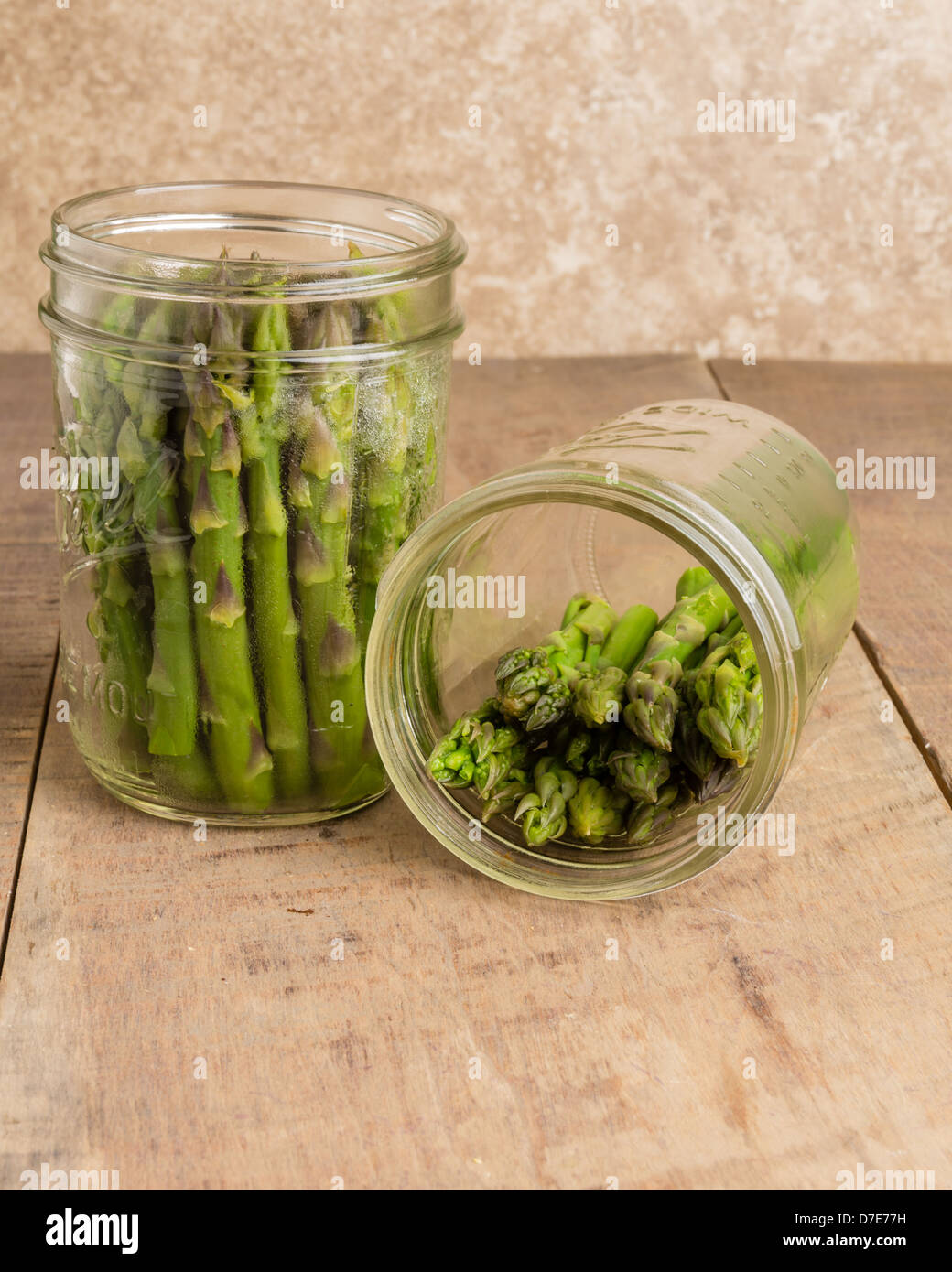 Fresh asparagus being preserved with pickling Stock Photo