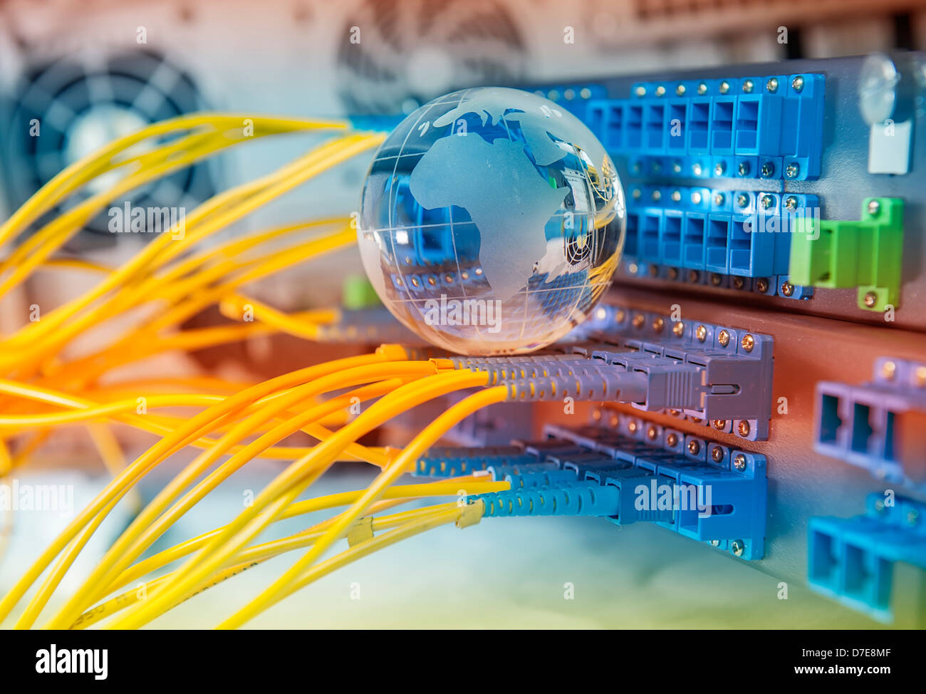 globe with network cables and servers in a technology data center Stock Photo