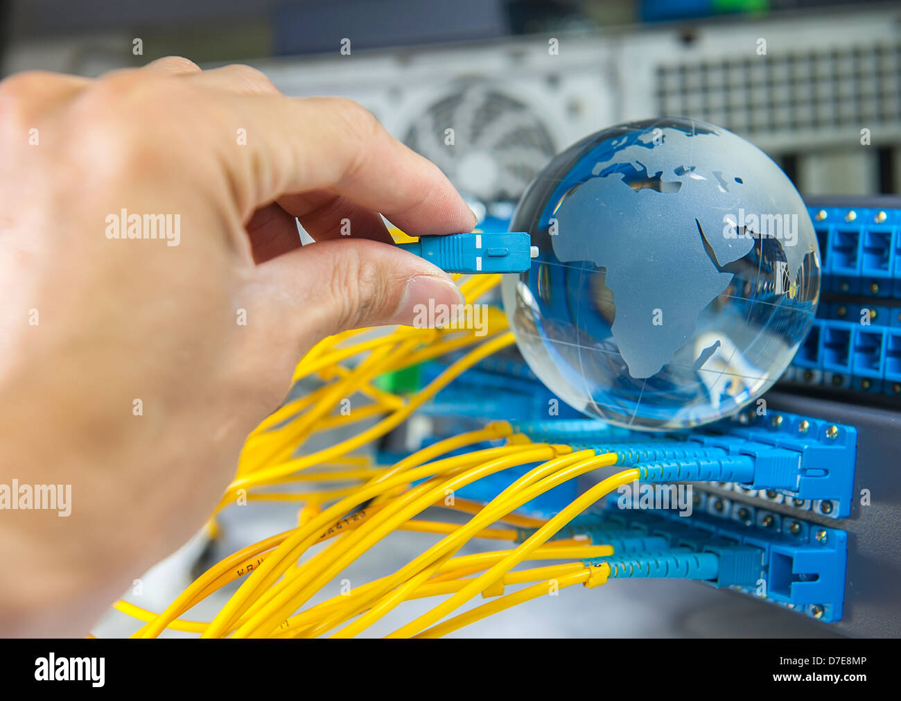 globe with network cables and servers in a technology data center Stock Photo
