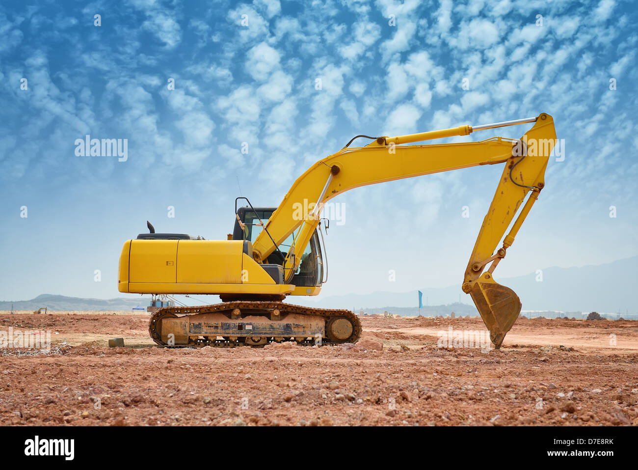 excavator loader machine during earthmoving works outdoors Stock Photo