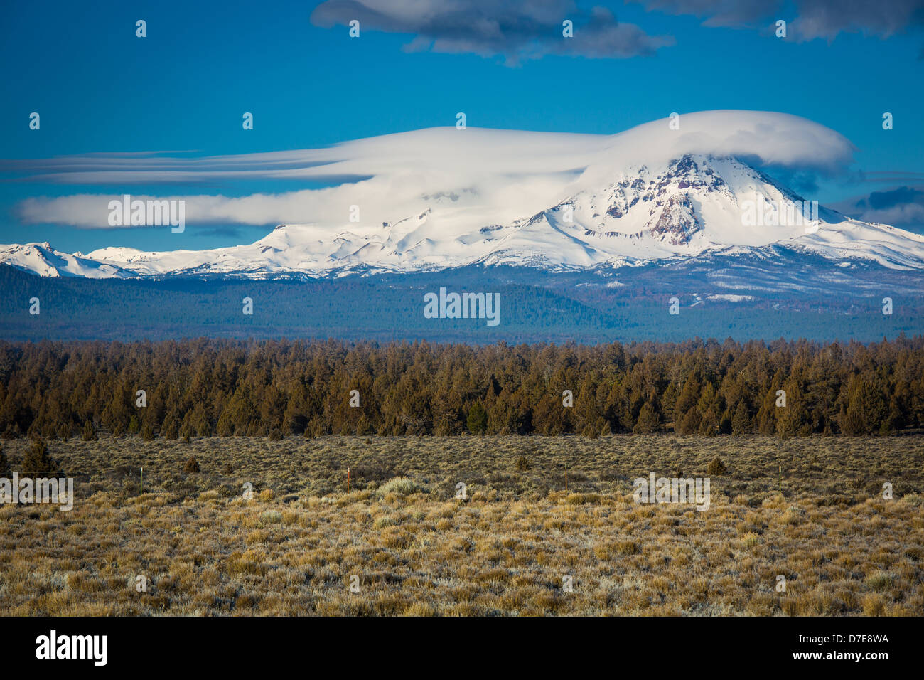 Lenticular clouds hovering over the peak of Broken Top mountains in the Sisters Wilderness of Oregon Stock Photo