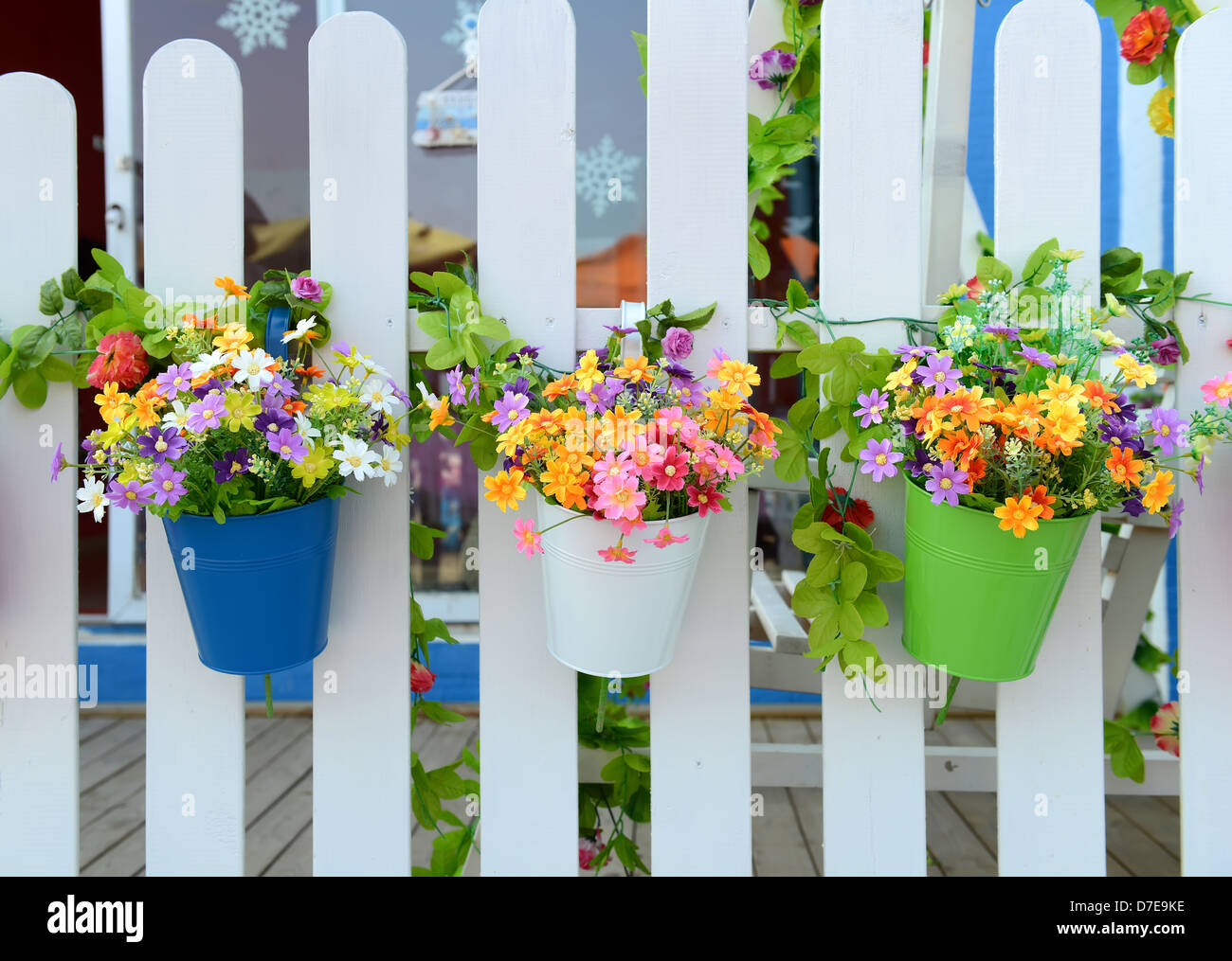 Hanging Flower Pots with fence Stock Photo - Alamy
