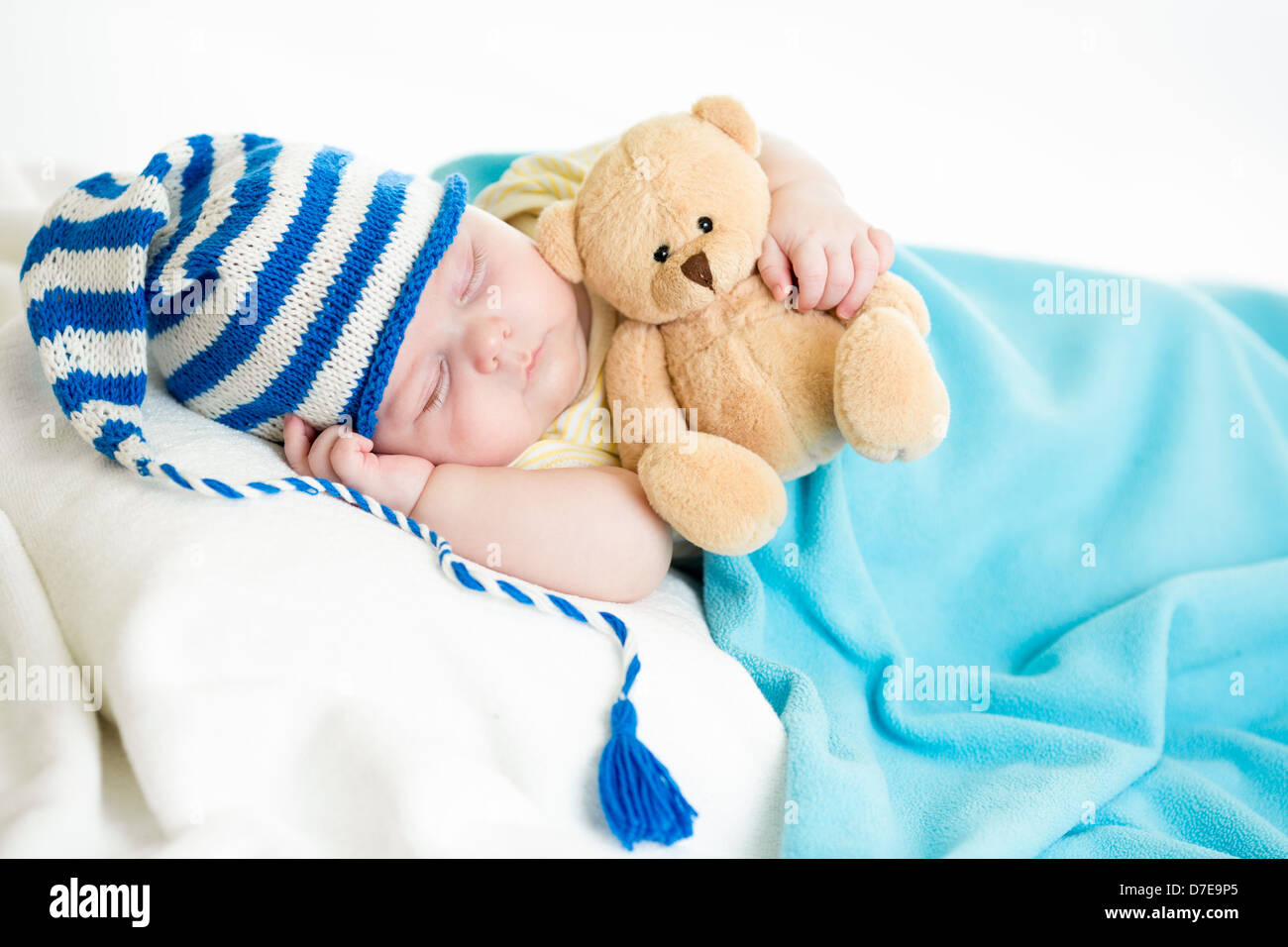 sleeping baby boy with toy Stock Photo Alamy