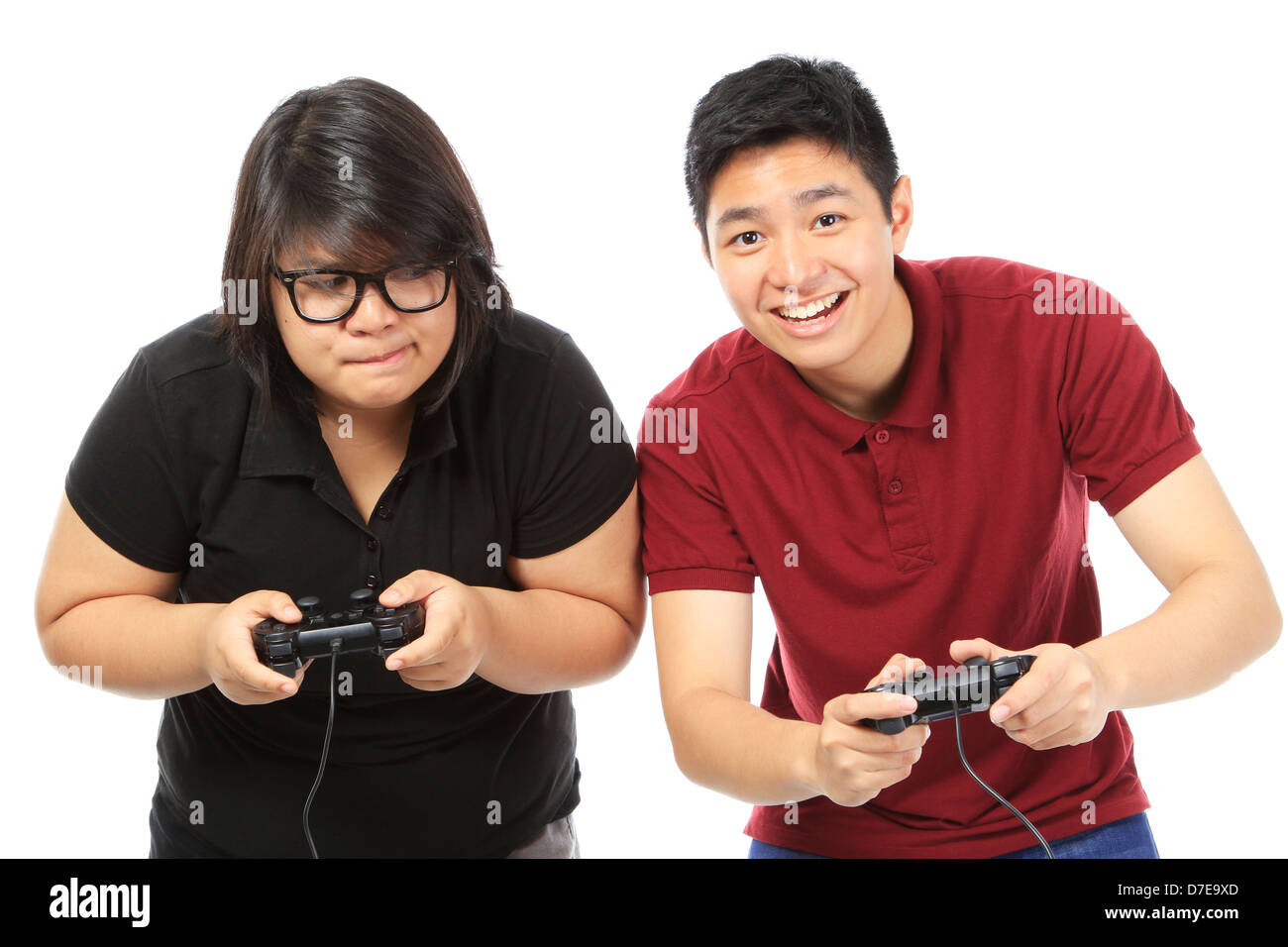 Teenagers competitively playing a video game Stock Photo