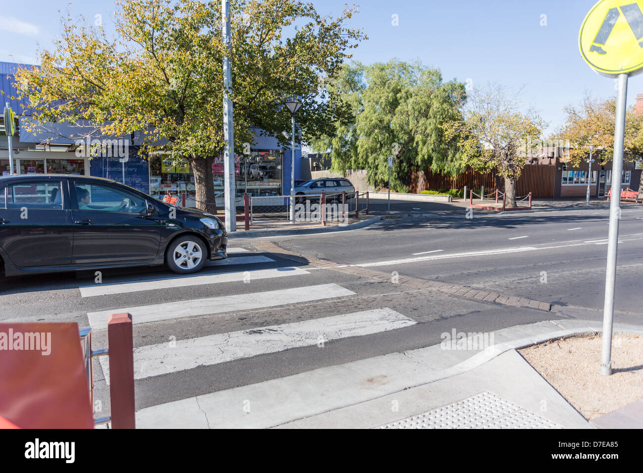 Zebra pedestrian crossing with cars, Sunbury, Victoria, Australia Stock