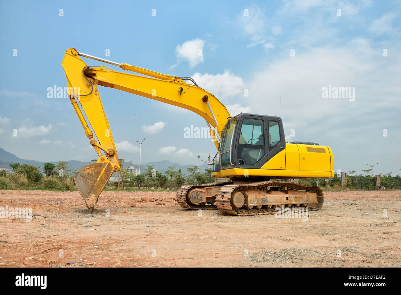 excavator loader machine during earthmoving works outdoors Stock Photo