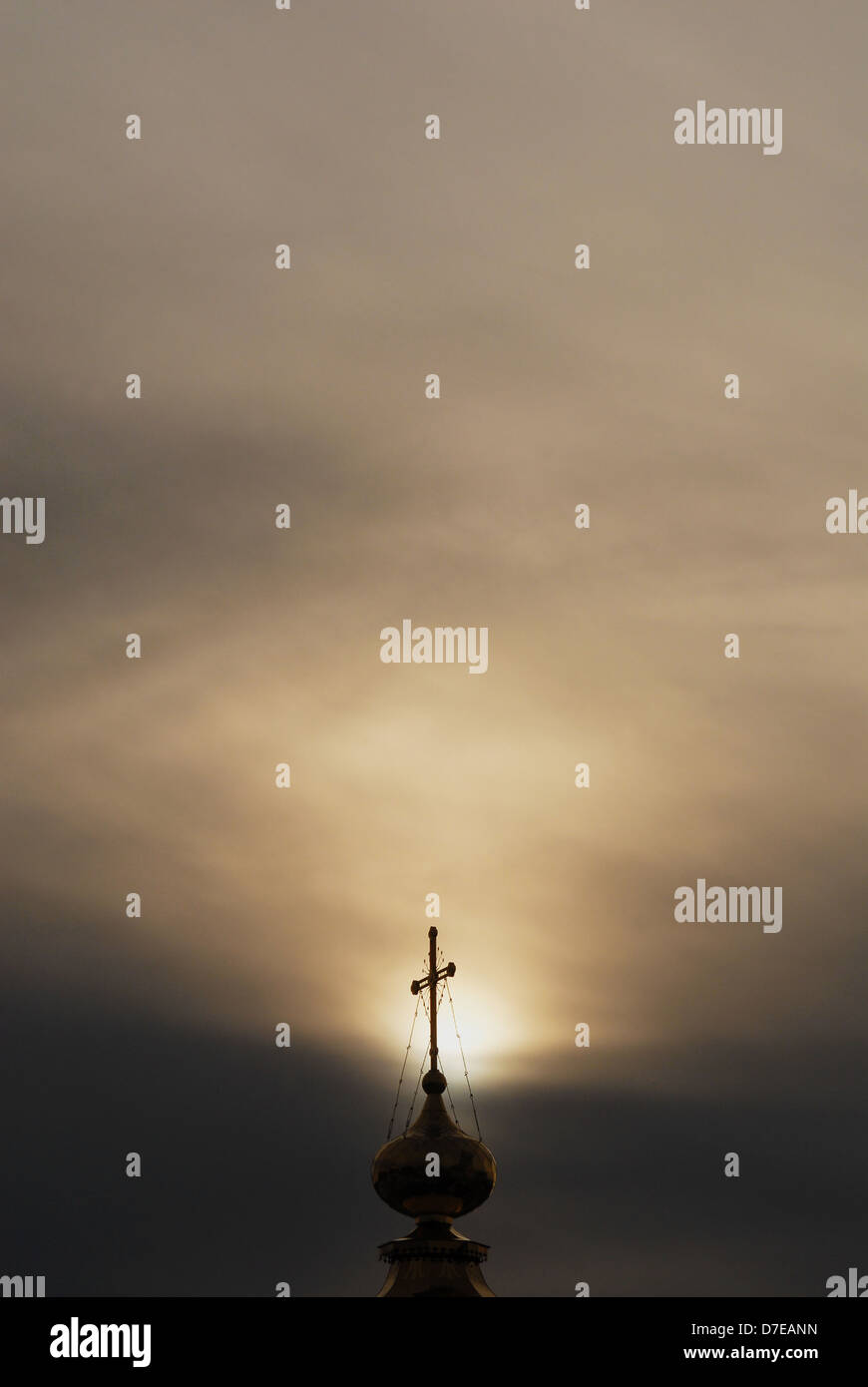 Golden dome and cross of an orthodox temple in a cloudy night sky ...