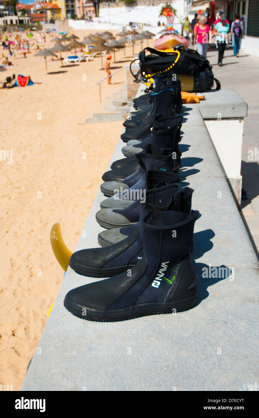 Row of neoprene boots for diving Stock Photo