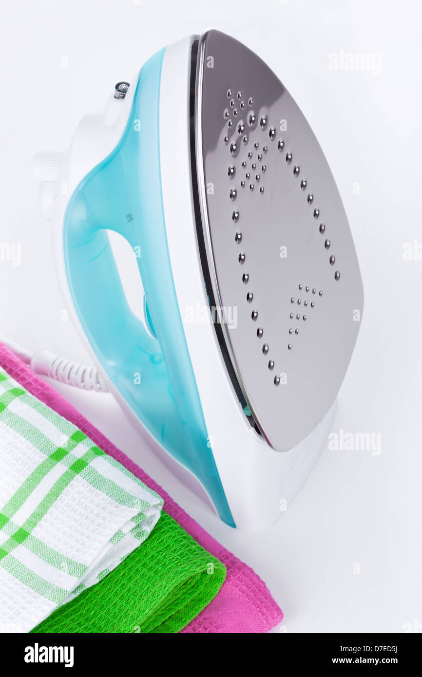Electric iron and color clothes Stock Photo Alamy