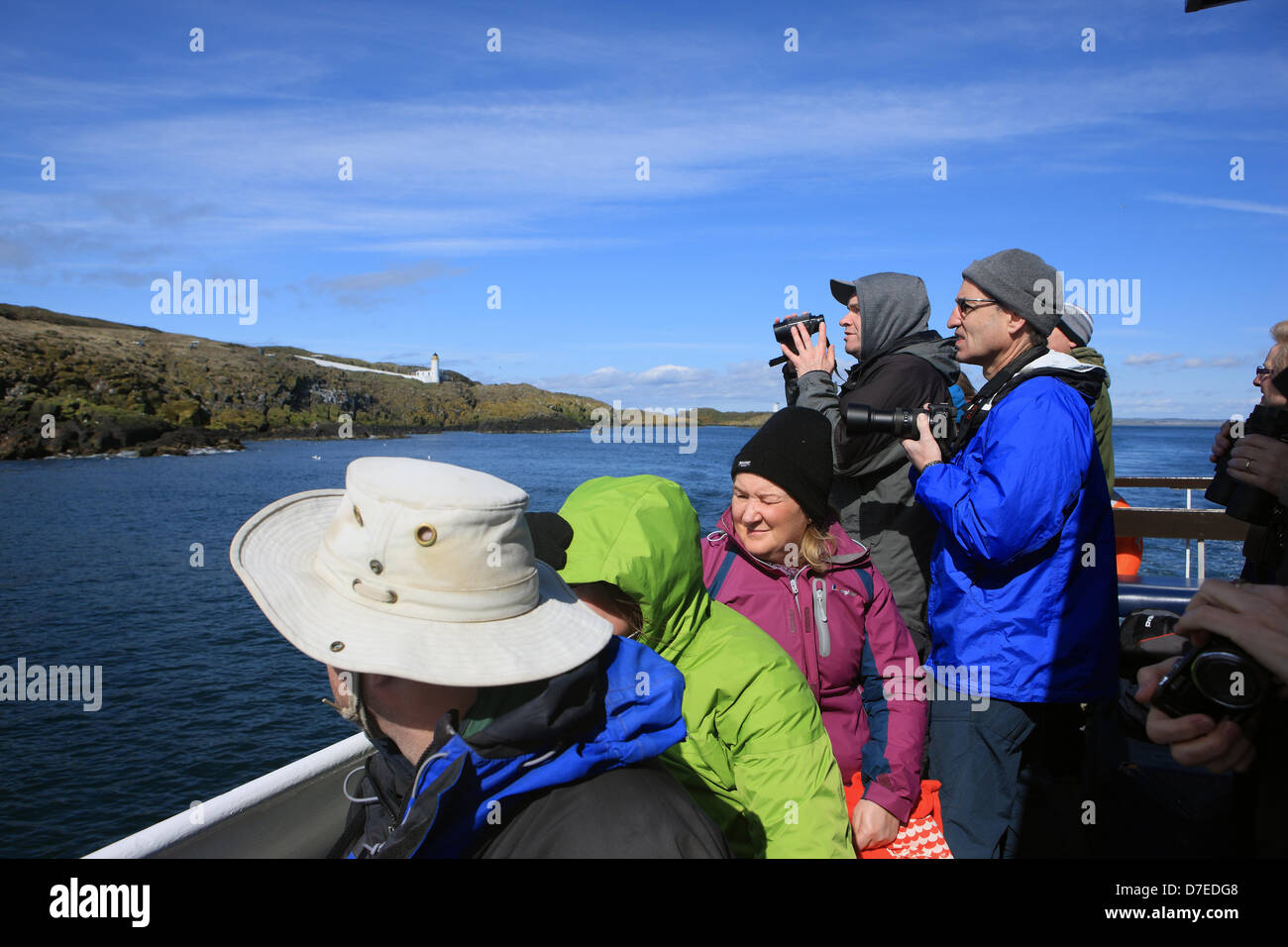 Firth of Forth, Scotland, UK. 5th May 2013. Day trippers taking advantage of the good weather and enjoying watching the puffins, razorbills and guillemots on a trip onboard the May Princess from Anstruther in Fife to the Isle of May National Nature Reserve in the Firth of Forth. Credit:  PictureScotland / Alamy Live News Stock Photo