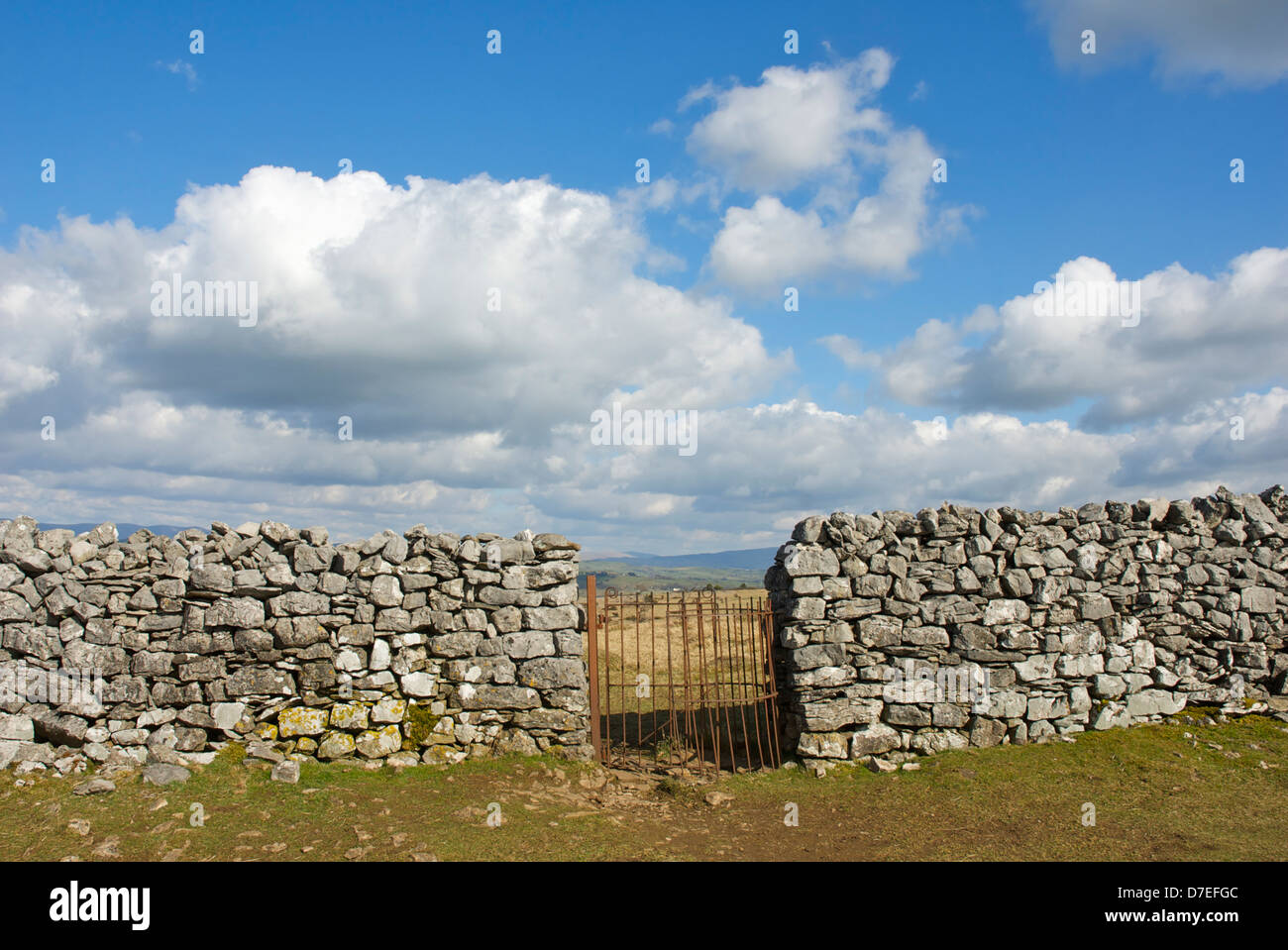 Kissing gate in dry stone wall, Cumbria, England UK Stock Photo