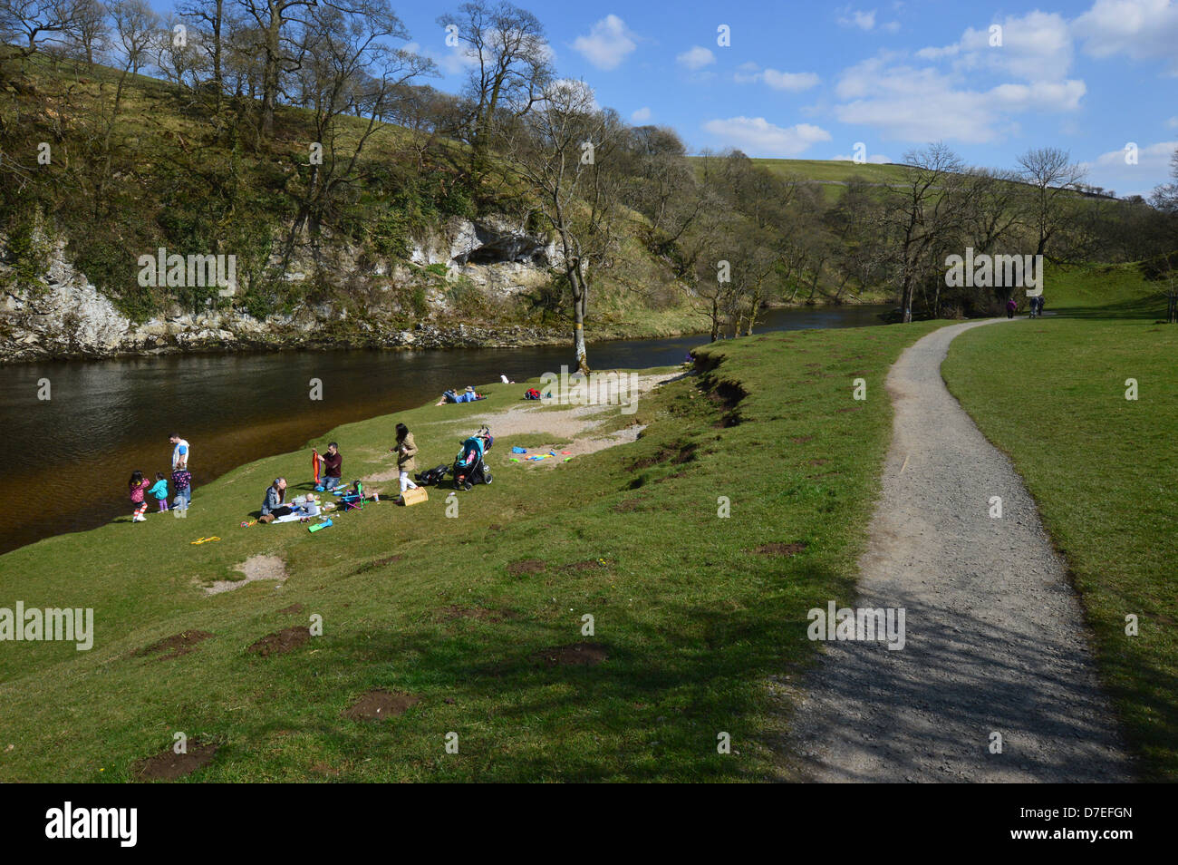 People Enjoying a picnic on the banks of the river Wharfe near Burnsall
