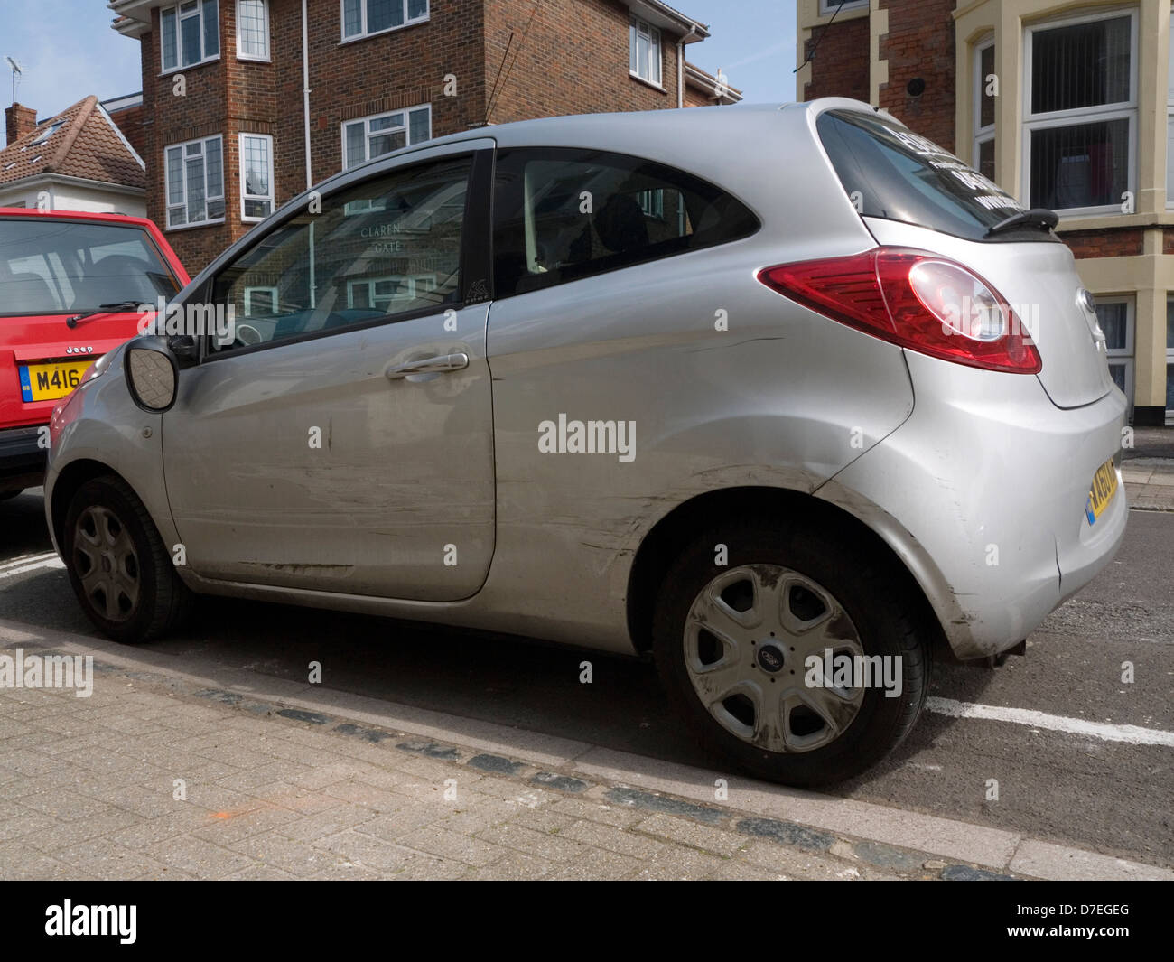 car showing scrapes along side after being involved in an accident Stock Photo