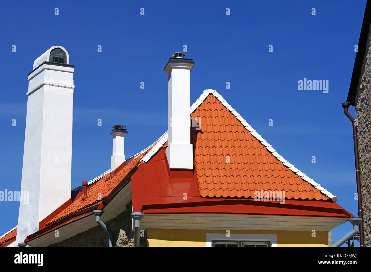 The roof and chimney with blue sky Stock Photo