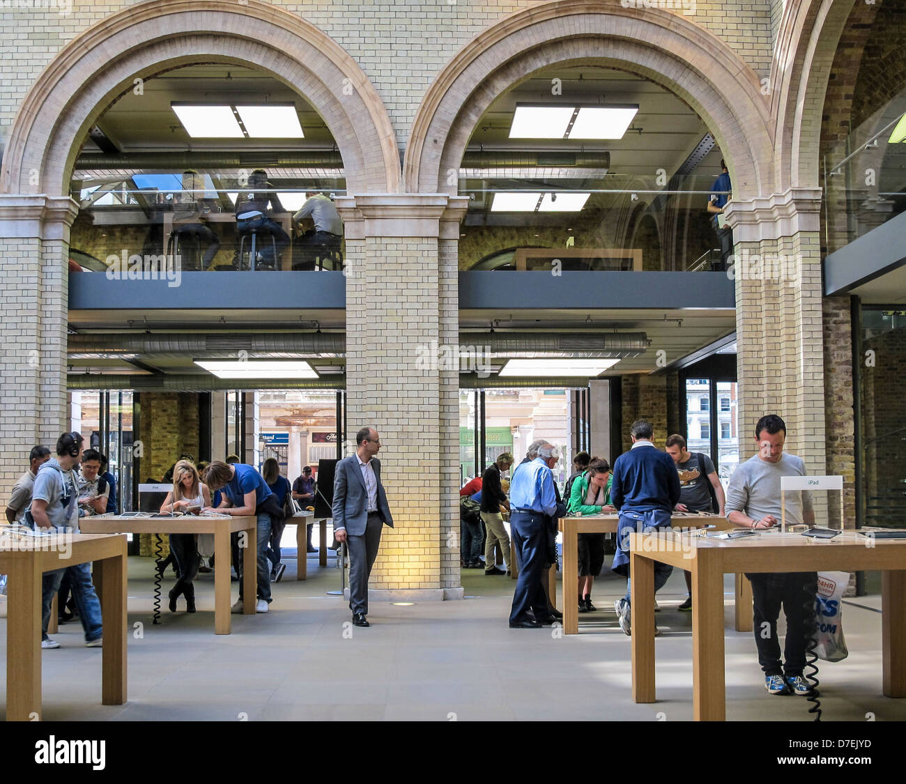 The Apple Store Covent Garden Shoppers Examine Products In The