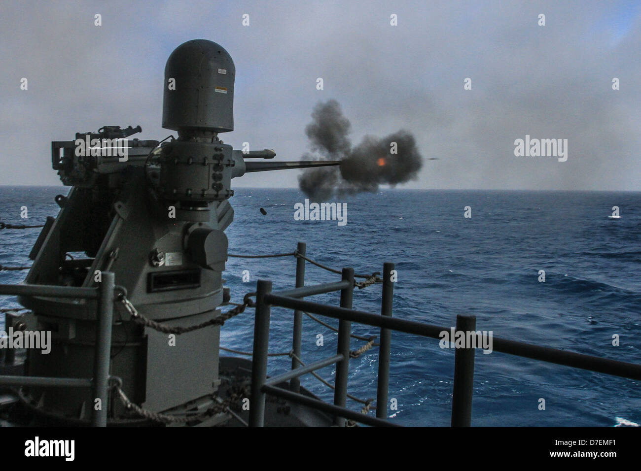 A 25 mm remote machine gun fires aboard USS Boxer Stock Photo Alamy