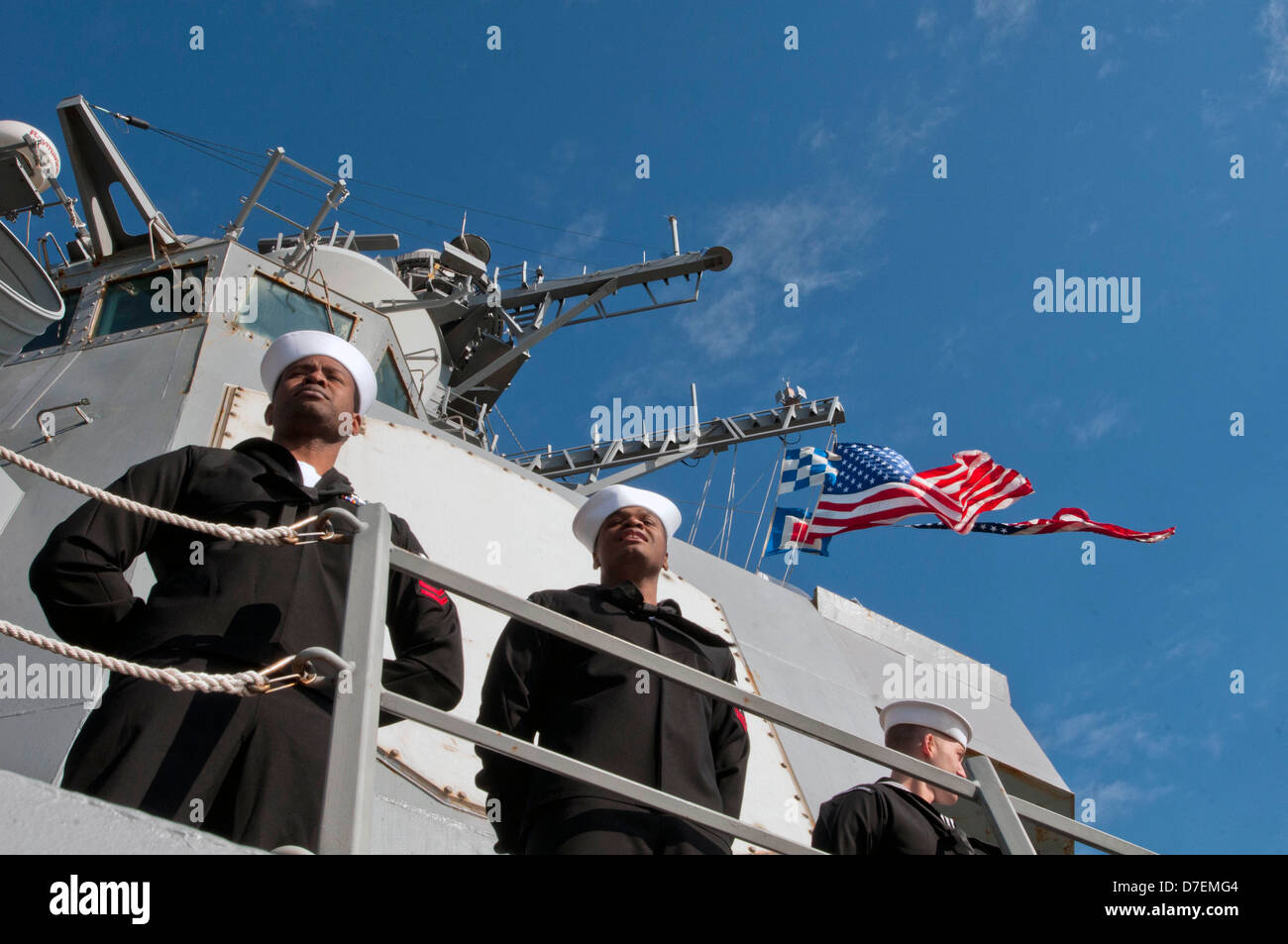 Sailors man the rails of USS Winston S. Churchill. Stock Photo