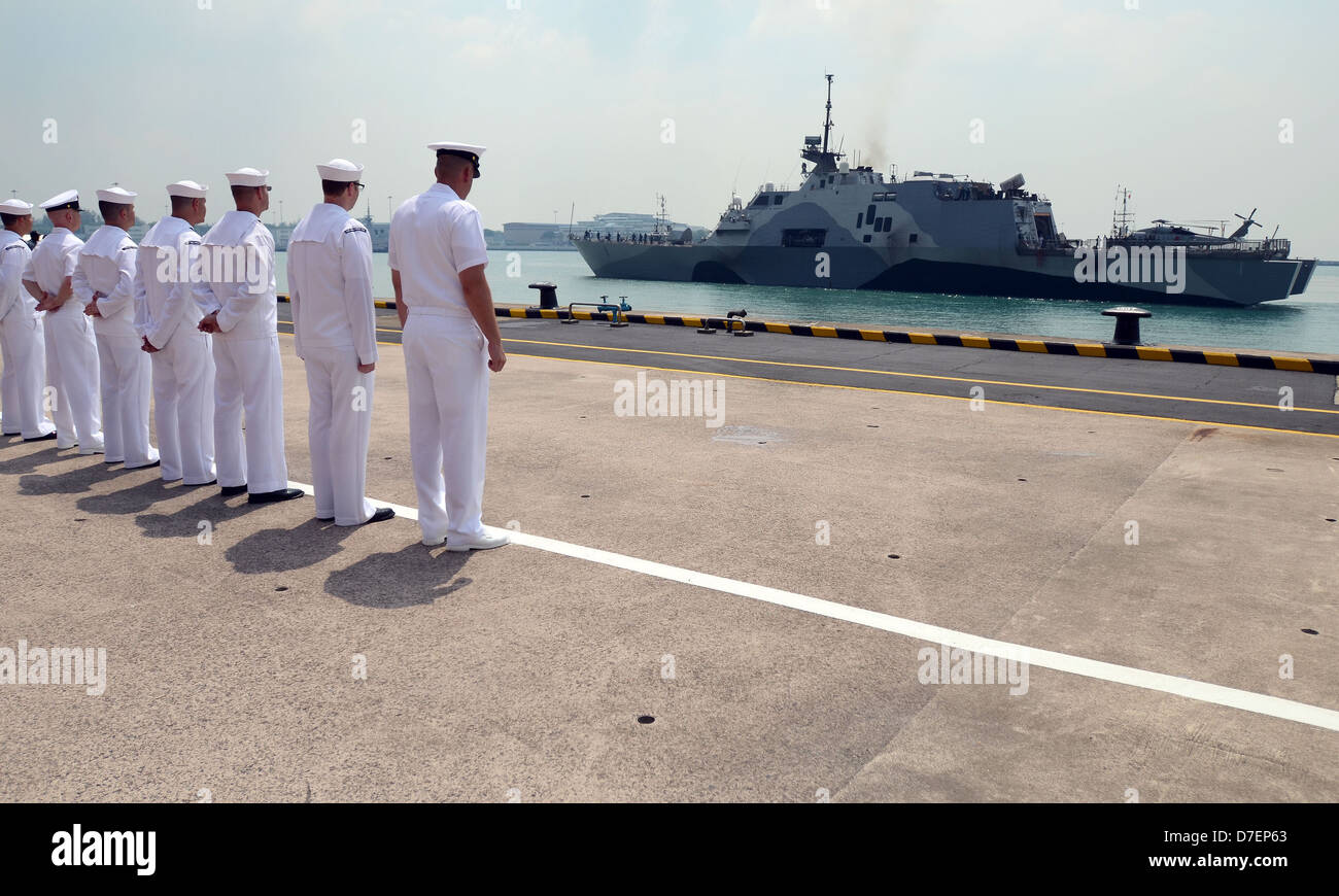 Sailors observe USS Freedom arrive in Singapore. Stock Photo