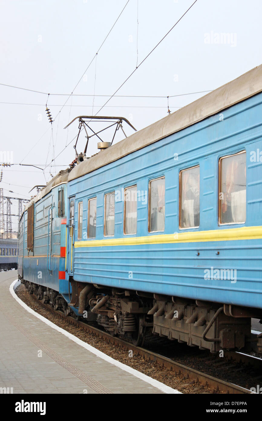 passenger train standing on railway station Stock Photo