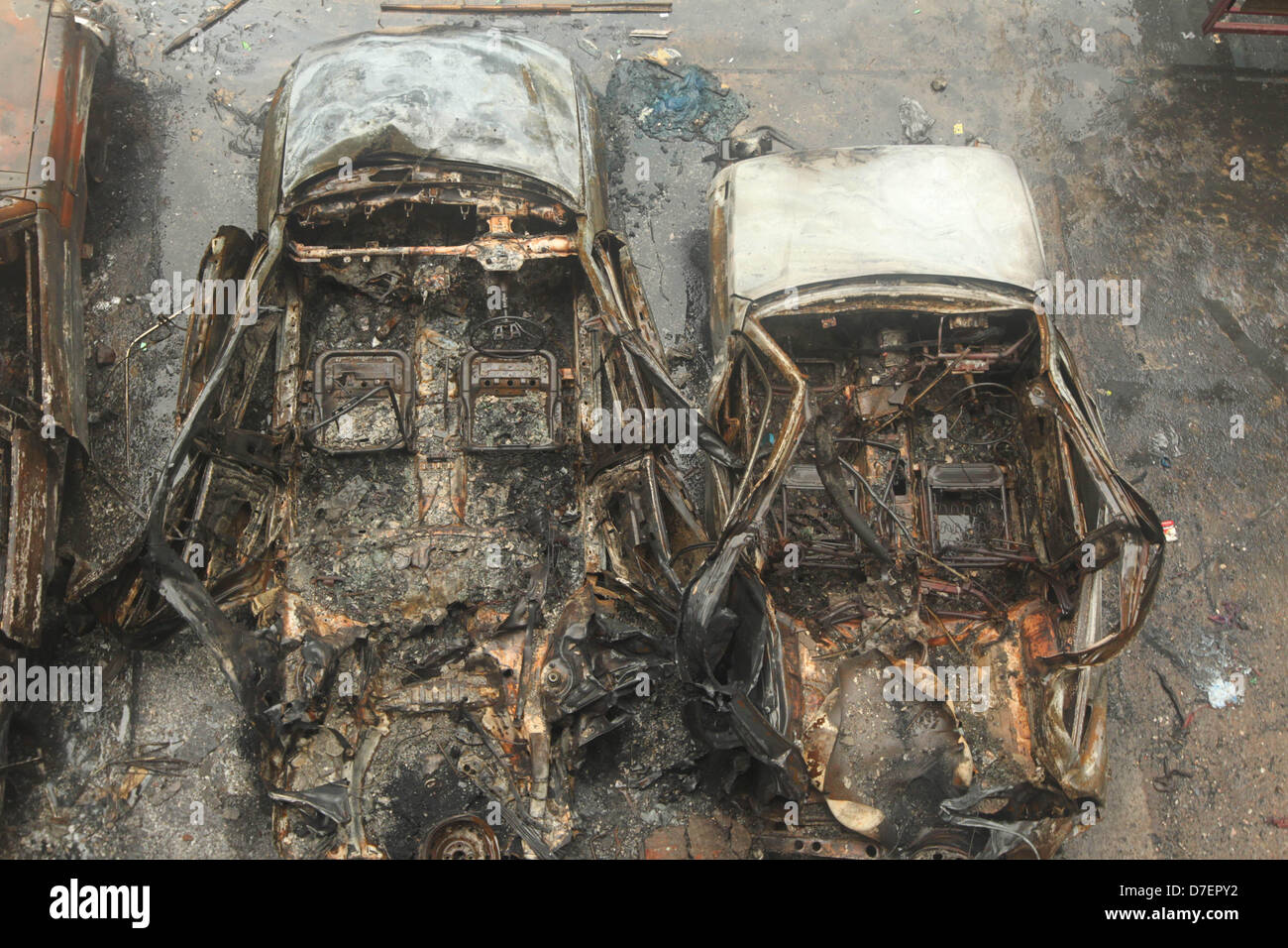 Dhaka, Bangladesh. 6th May, 2013. A several burnt car left on the House ...
