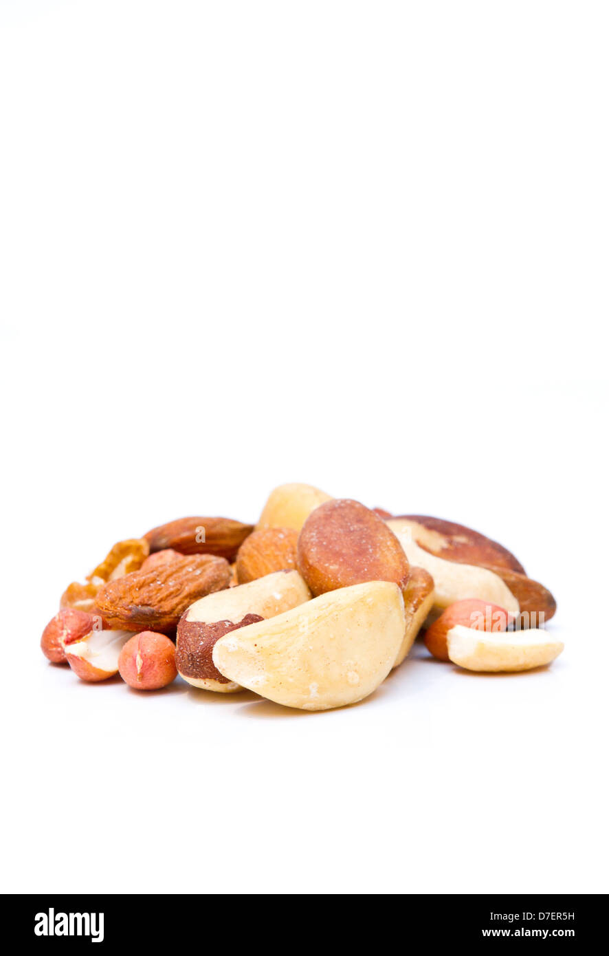 mixed nuts on white with copy space Stock Photo