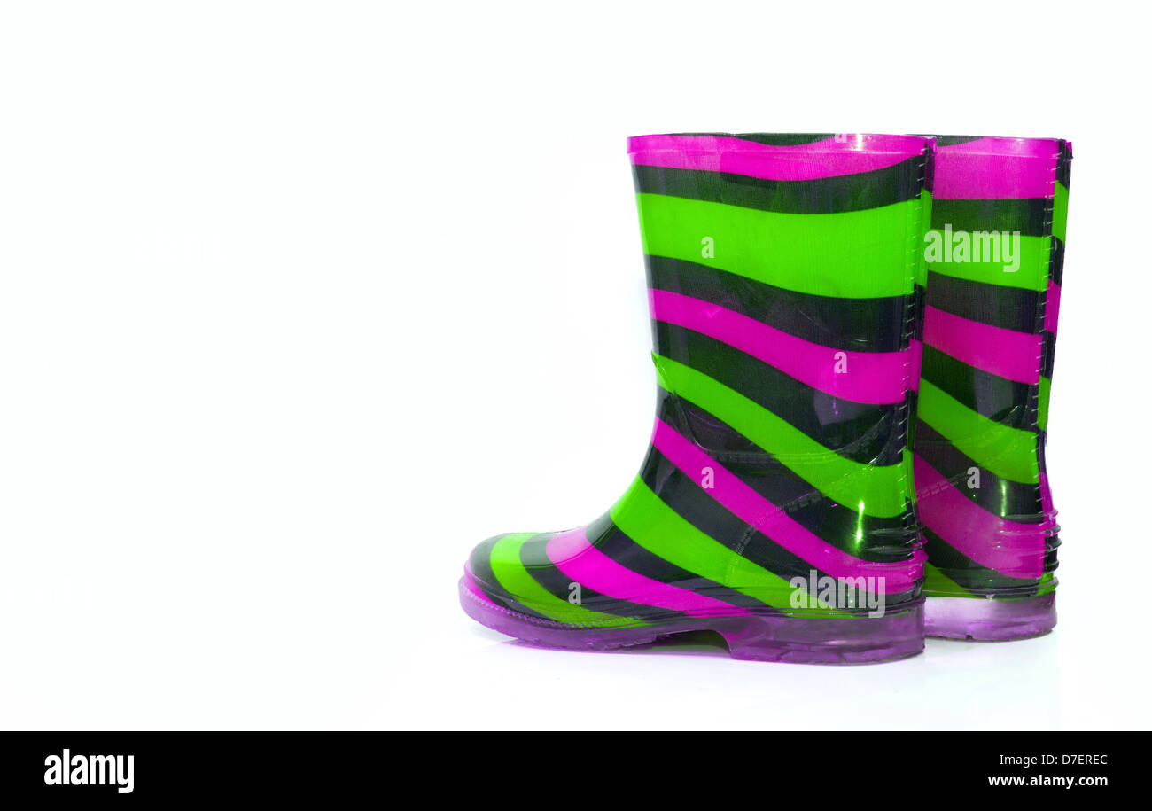 Multi Coloured wellington Boots on white with copy space Stock Photo