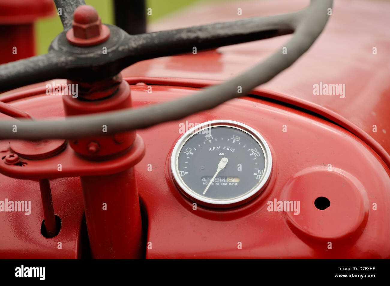 A detailed shot of a tachometer and hour counter on a mc cormick tractor Stock Photo Alamy