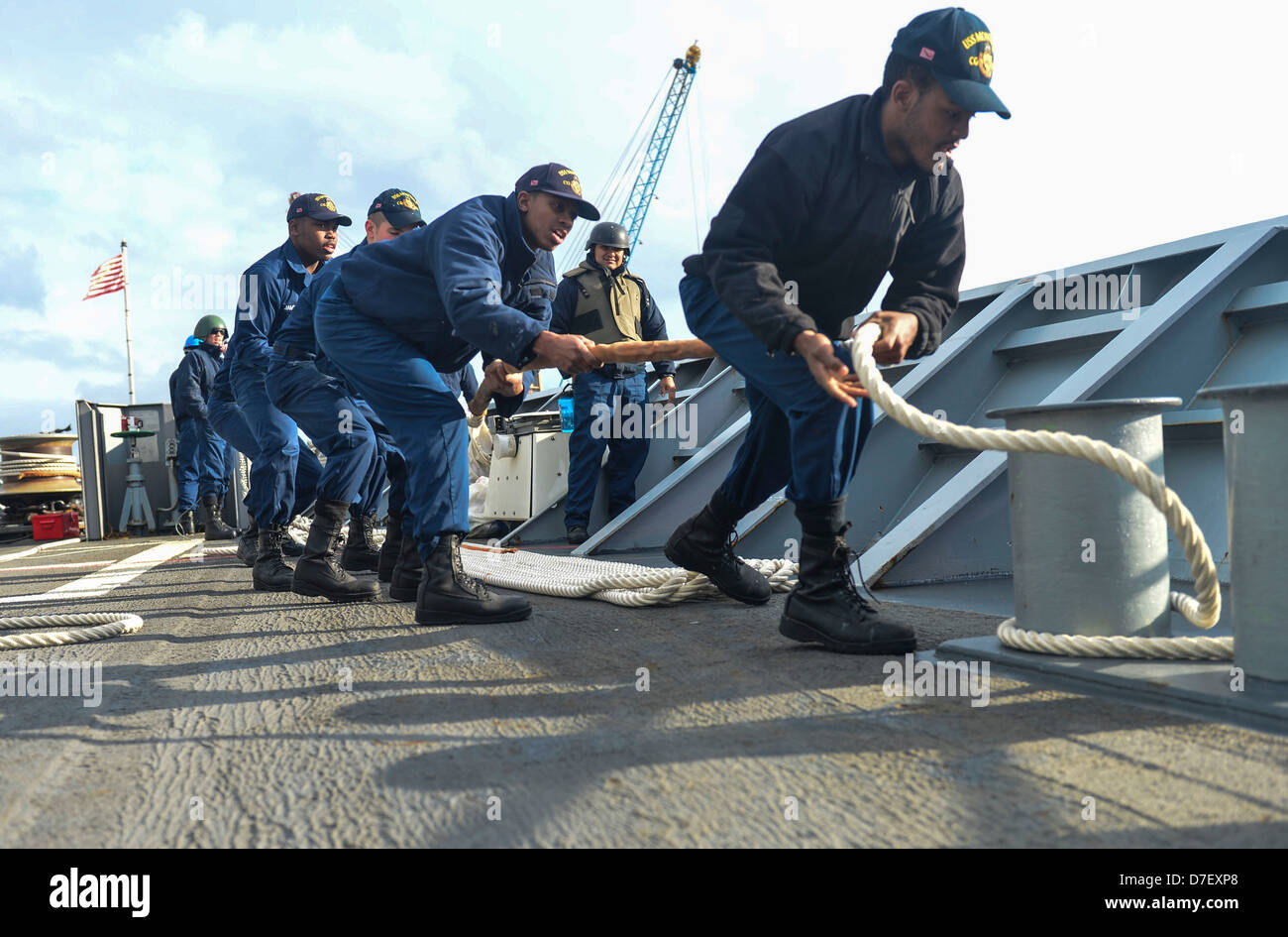 Sailors handle lines. Stock Photo
