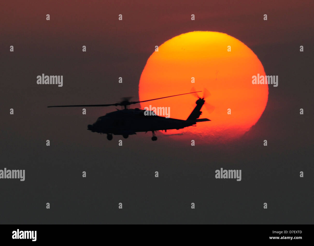 A Sea Hawk helicopter at sunset. Stock Photo