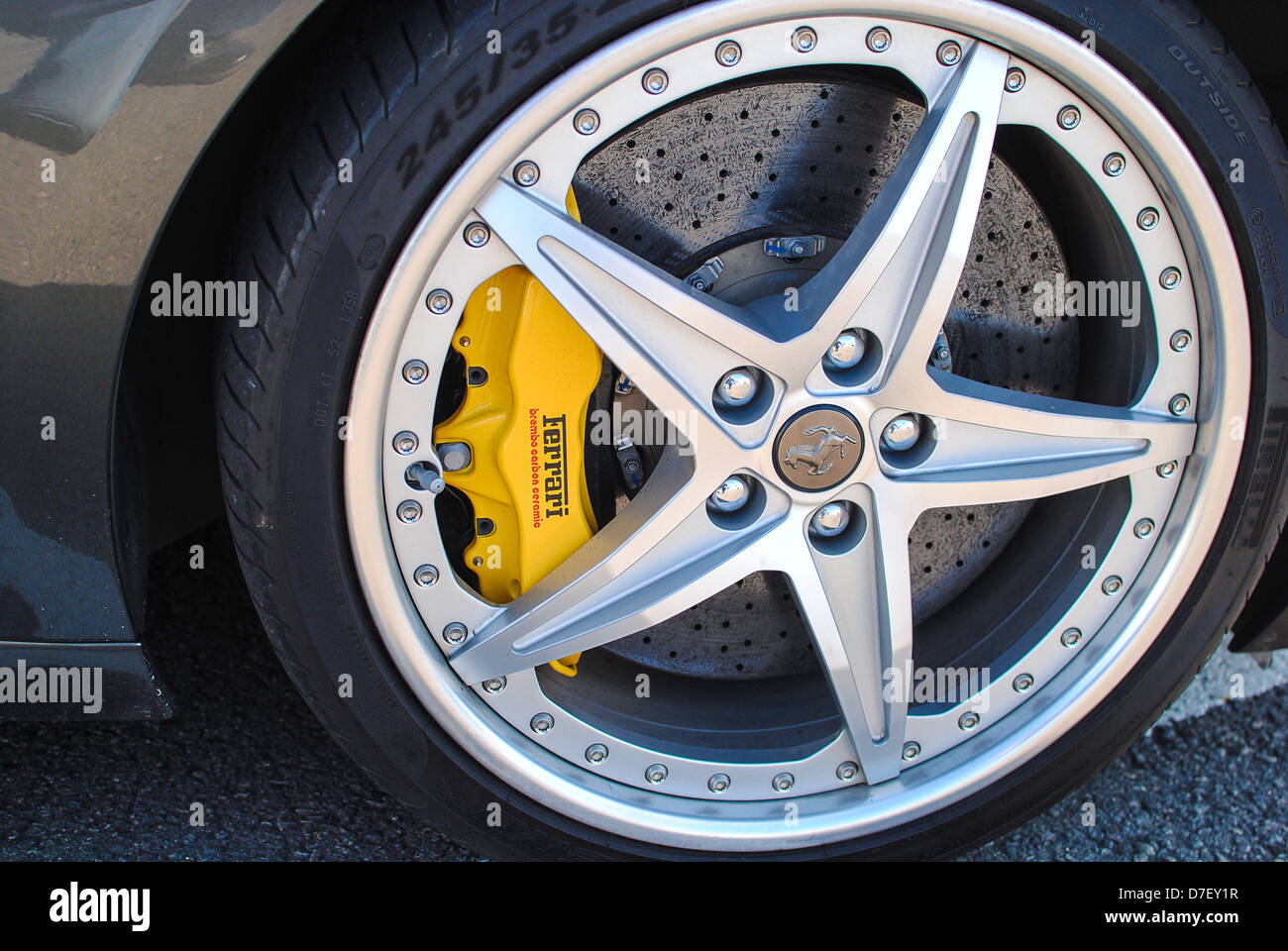 Yellow Ferrari brake caliper Stock Photo - Alamy