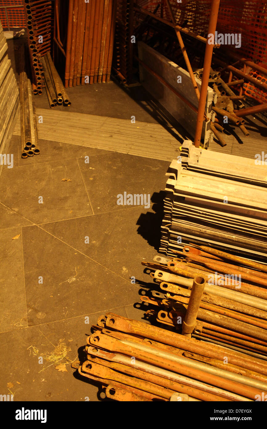 many construction scaffolding fittings in a pile at night Stock Photo