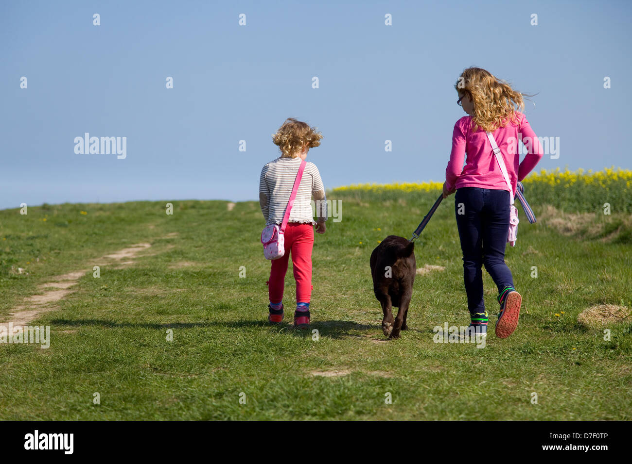 North Norfolk Coast Uk Weather Two Girls Walk Their Chocolate Stock Photo Alamy