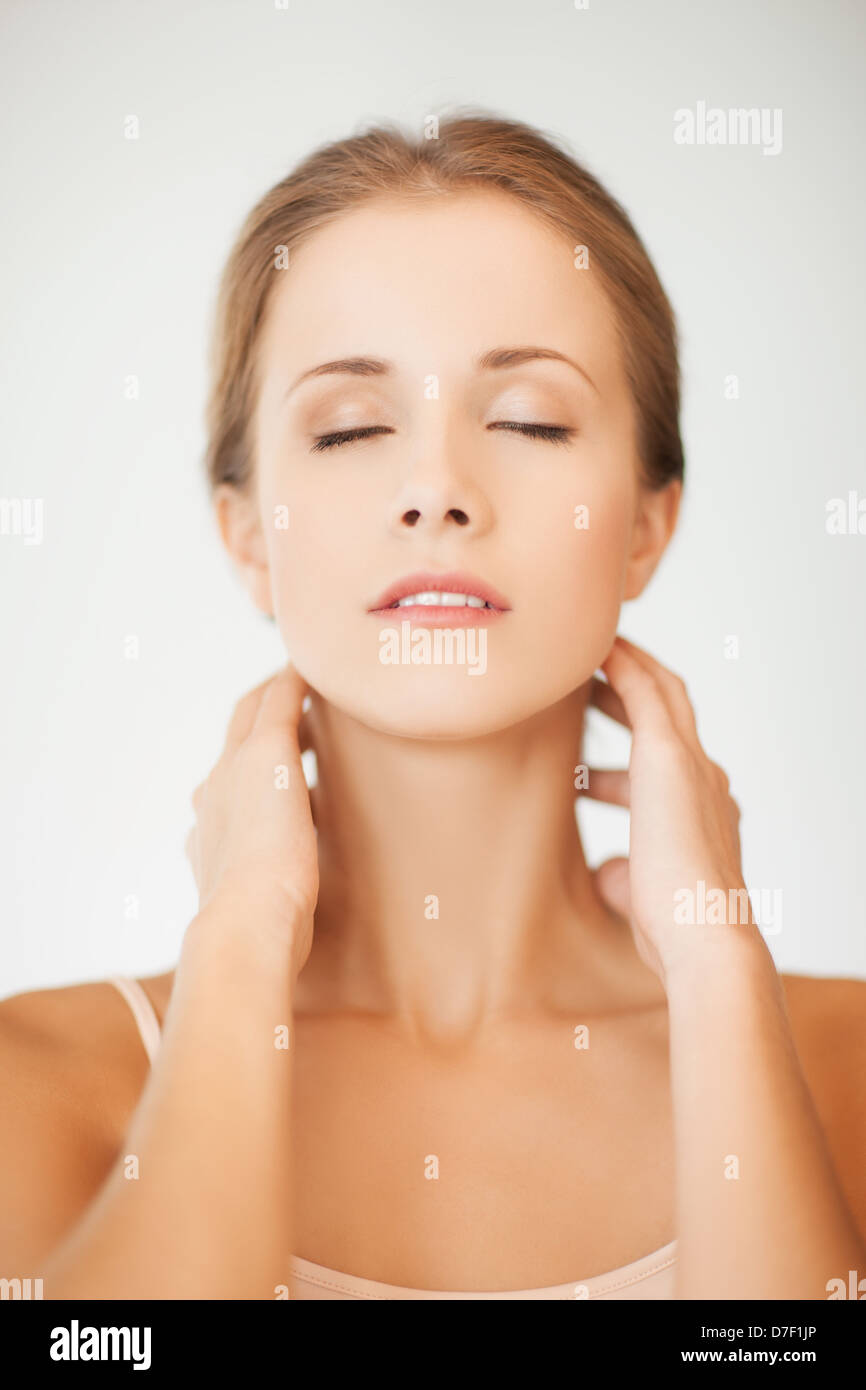 woman holding hands on her neck Stock Photo Alamy