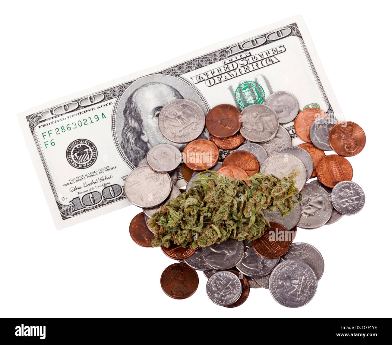 A high grade hydrophonic Cannabis (Marijuana) bud resting on pile various USA coins - pennies quarters dimes nickels as awell Stock Photo