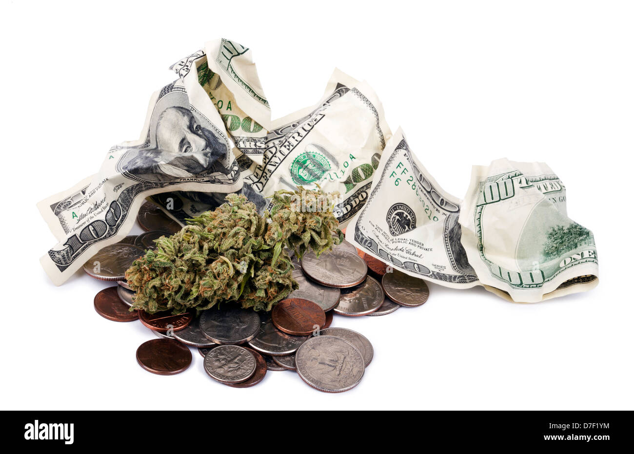 A high grade hydrophonic Cannabis (Marijuana) bud resting on pile various USA coins - pennies quarters dimes nickels crunpled Stock Photo