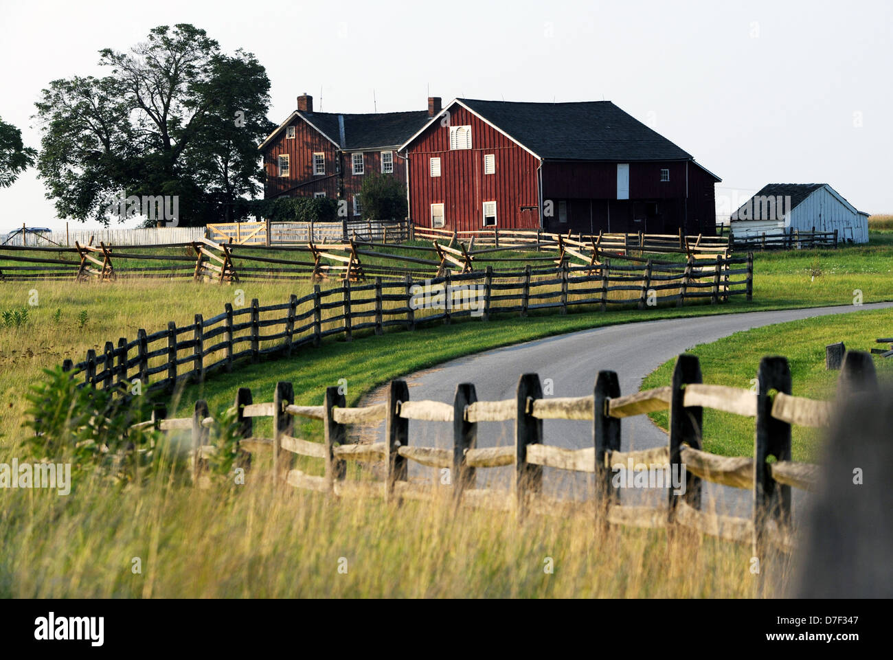 Winding road with split rail fence grass field to Gettysburg farm Pennsylvania, Farm Gettysburg Pennsylvania, Stock Photo