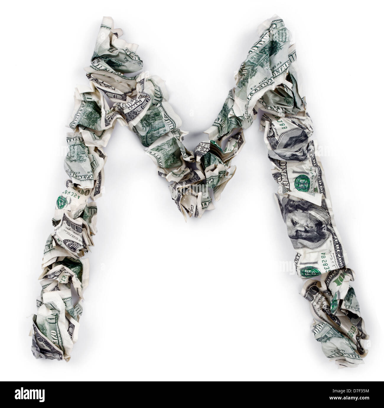 The letter 'm' made out of crimped 100$ bills. Isolated on white background. Stock Photo