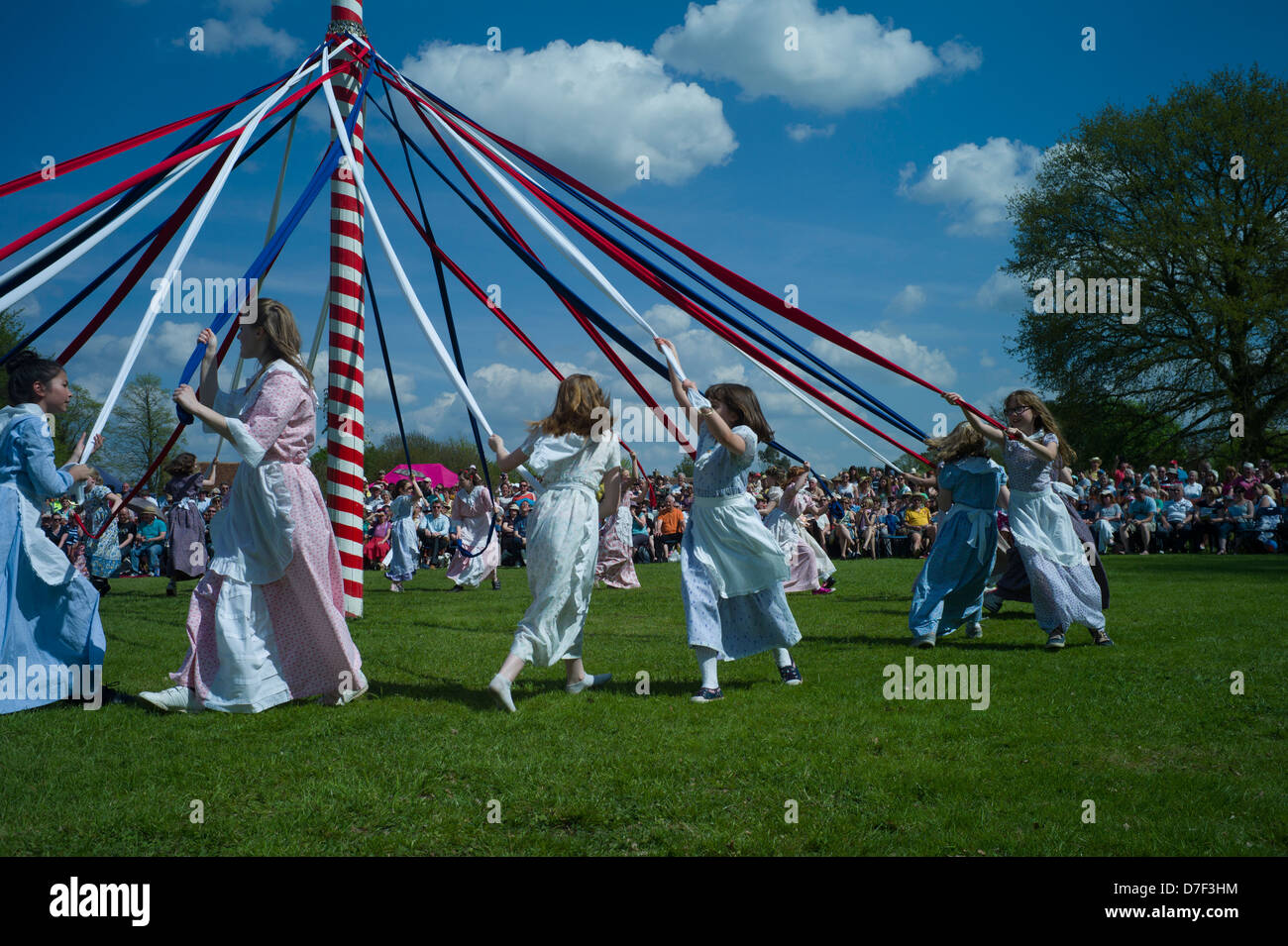 May Pole Dancing, Ickwell, Bedfordshire,England,May 2013. Children dancing around the Maypole on the village green at Ickwell. Stock Photo