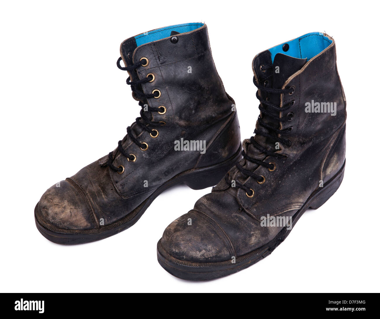 High Angle diagonal view of a very worn pair of boots, issued by the Israeli army (IDF). isolated on white background. Stock Photo