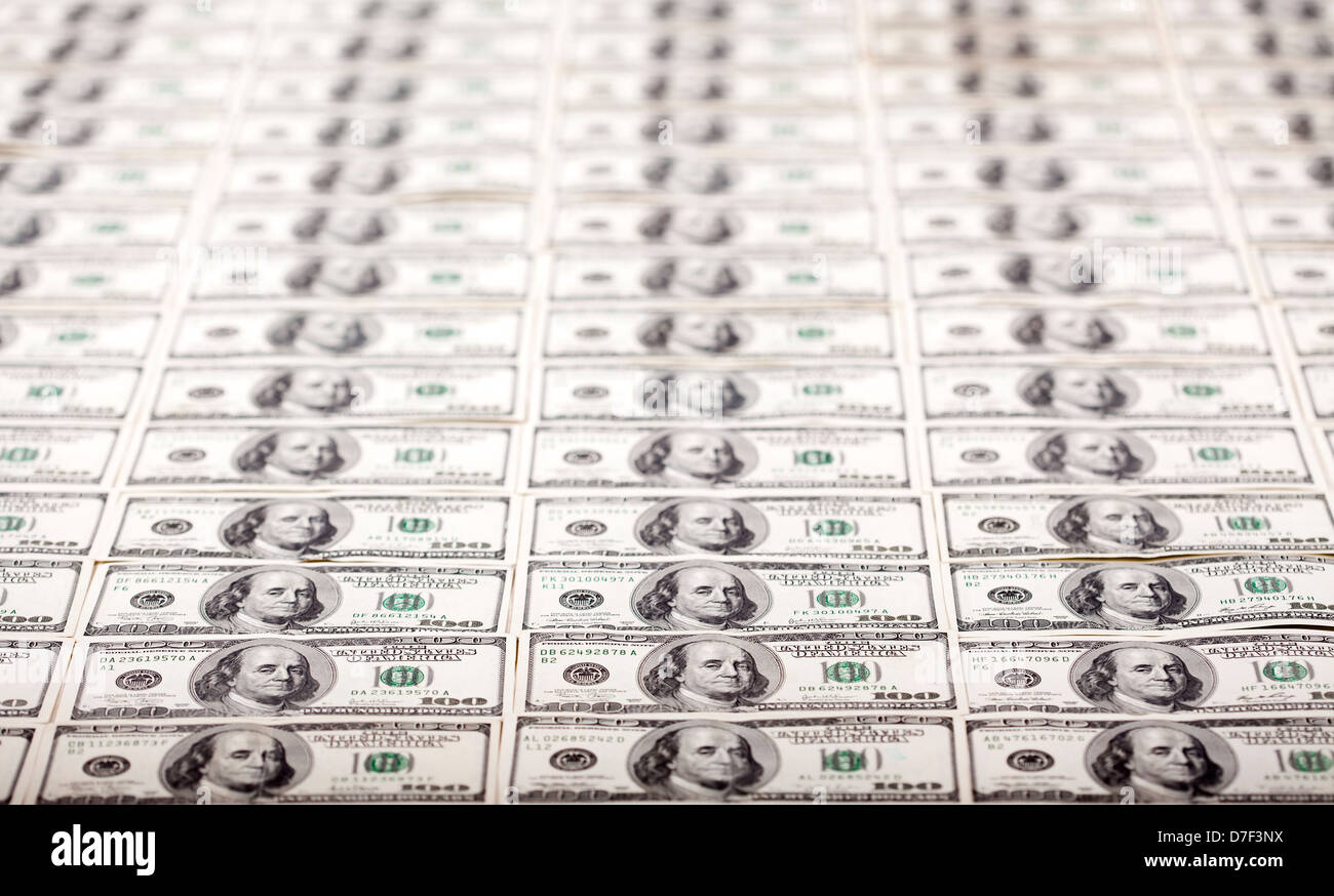 A high angle view of a very large amount of 100 US$ money notes, with a ...