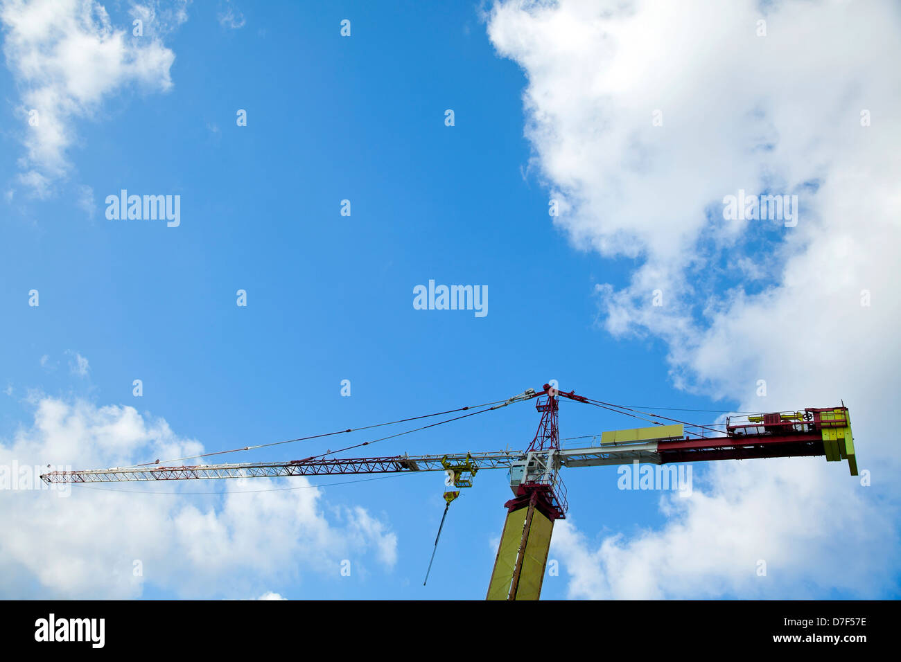 Low angle shot of the top part of a tower construction crane on the ...