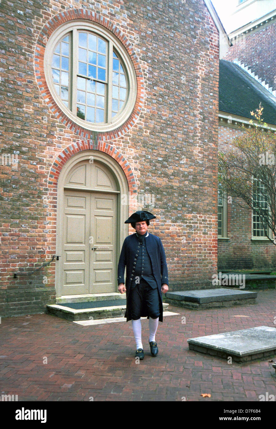 Benjamin Franklin impersonator in court yard Bruton Parish Church Williamsburg Virginia, Stock Photo