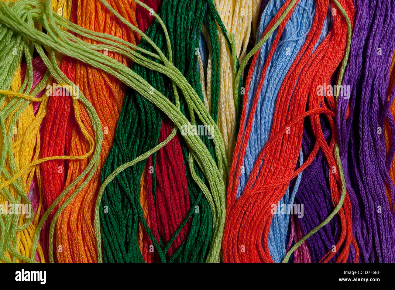 Multicolored embroidery thread mixed up and tangled Stock Photo